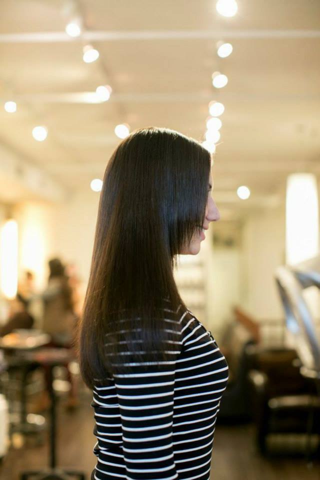 After K tip extensions: brunette hair, side view · facing right