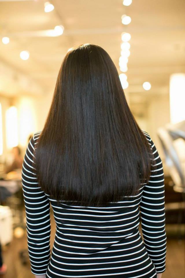 After K tip extensions: brunette hair, back view